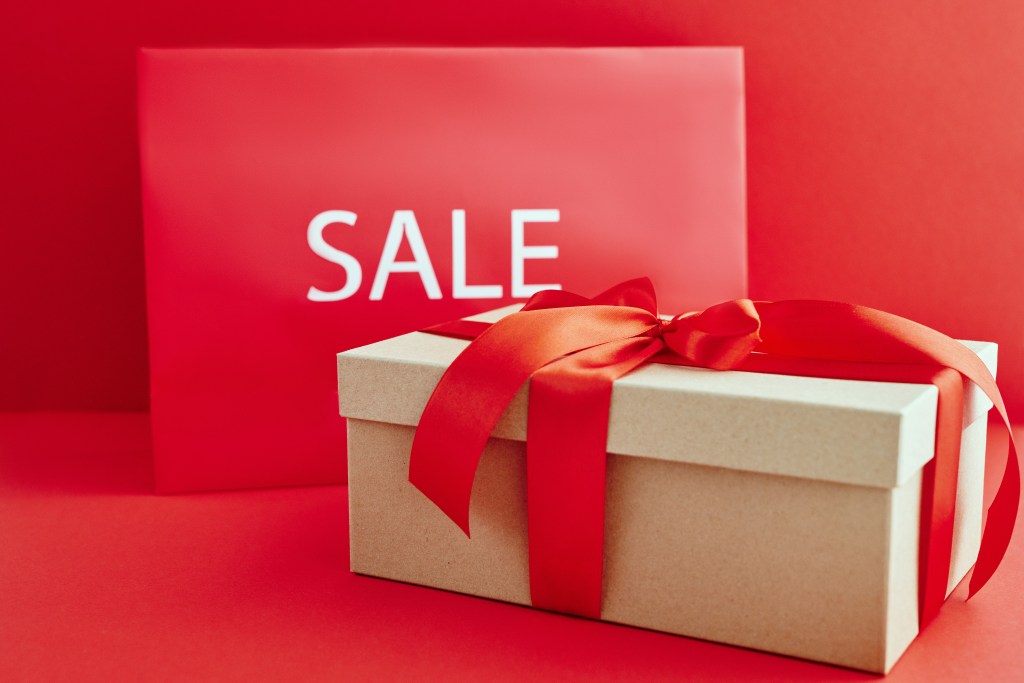 cardboard-box-with-red-ribbon-beside-a-sale-sign-5872364 deals_gifts_1625286229.jpeg Max Fischer at Pexels