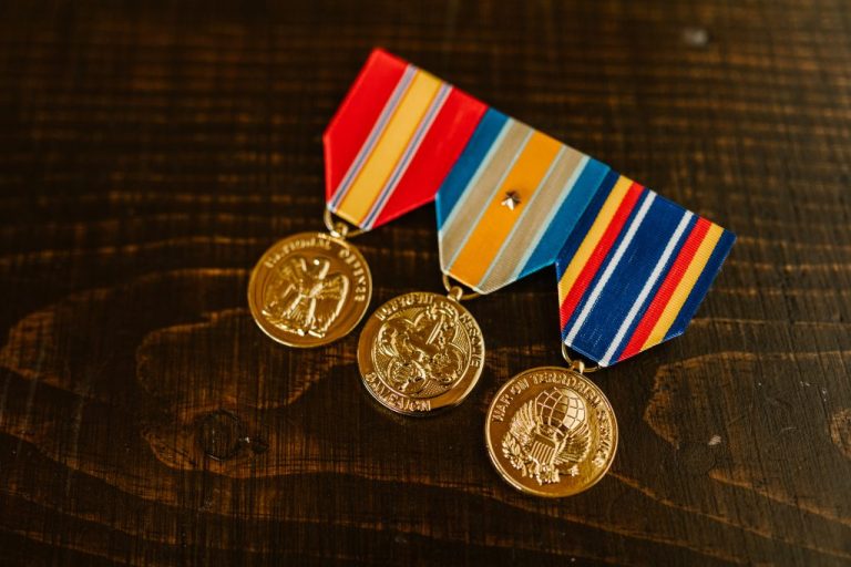 close-up-photo-of-medals-on-wooden-surface-7468243 medal_of_1679987588.jpeg RODNAE Productions at Pexels