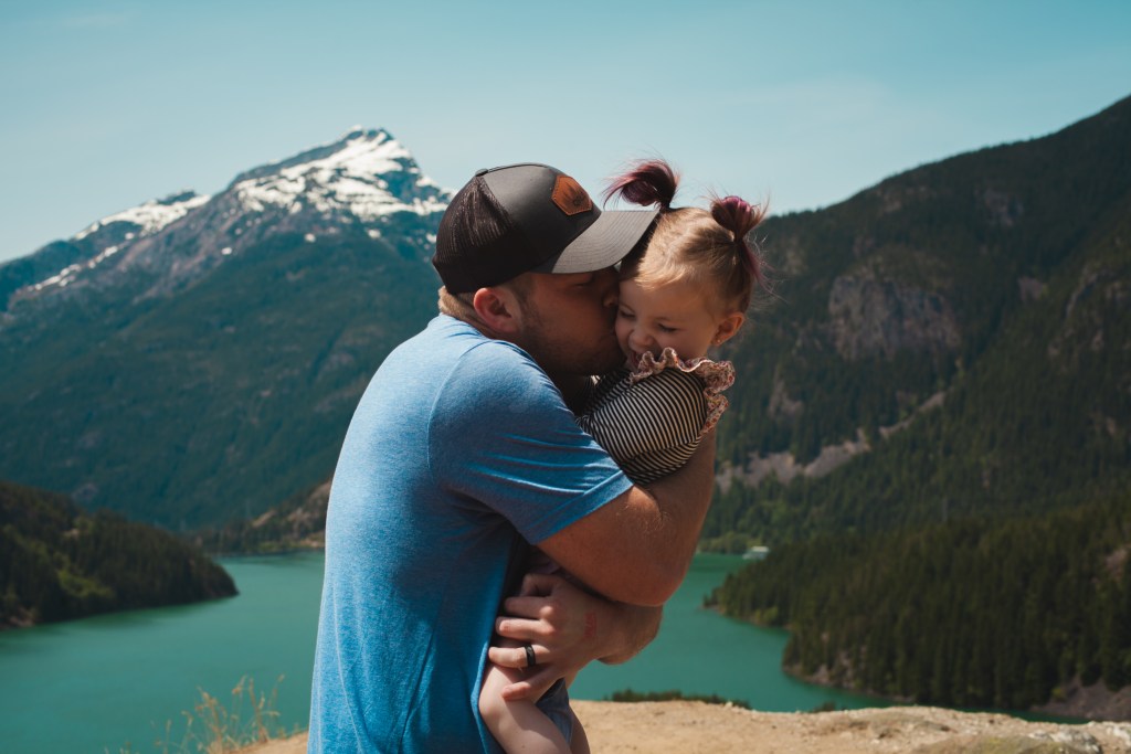 father-hugging-and-kissing-his-daughter-in-a-mountain-landscape-1157394 fathers_day_1687137235.jpeg Josh Willink at Pexels