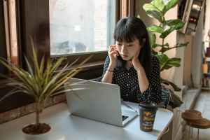 woman-in-black-and-white-long-sleeve-shirt-sitting-at-table-with-macbook-5915203 balance_work_1703046311.jpeg RDNE Stock project at Pexels