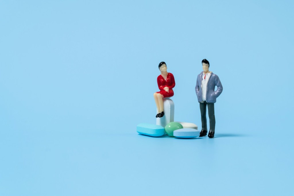 a man and a woman on a small model of a man.jpg