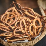 a basket filled with pretzels sitting on top of a table.jpg