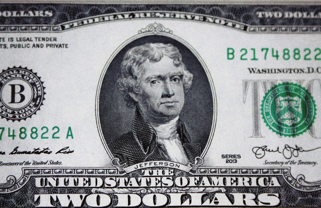 us dollar bill on black and white textile.jpg