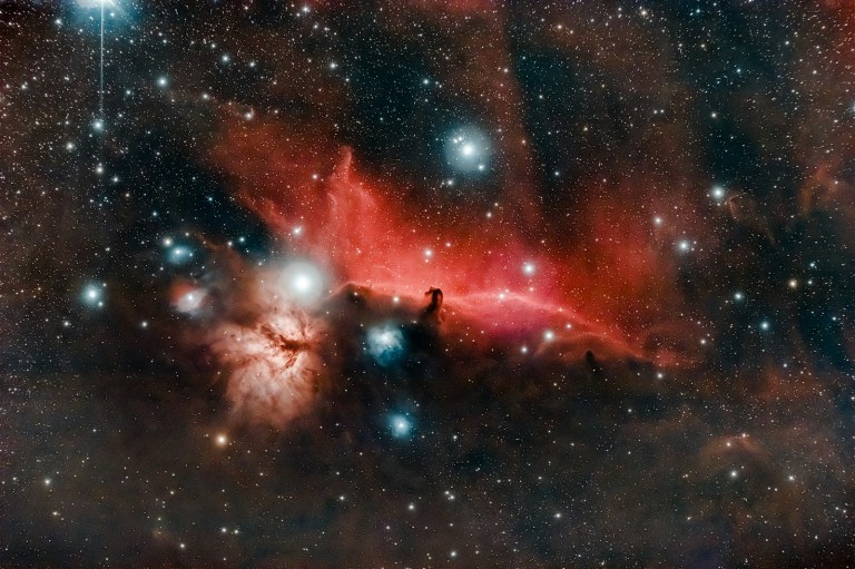 red and black galaxy with stars.jpg