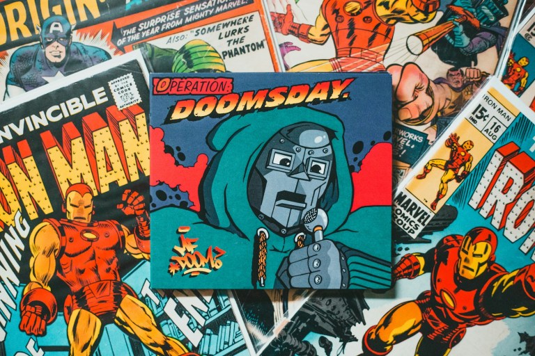 a bunch of comic books laying on top of each other.jpg