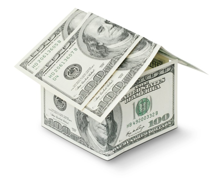 a house made out of money on a white background.jpg