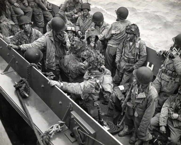 Glider pilots, among the first to land in Normandy and disrupt enemy communications, are on their way back to England. They are shown in an LVCP, which is taking them to larger craft off invasion beachhead in France. NARA REF#: 80-G-252451. Date: 6-8-1.jpg