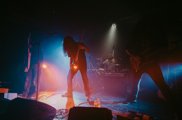 man in black shirt playing rock%20n%20roll on stage.jpg