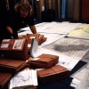 c.1997. Suzanne Wiley preparing paper maps for aerial survey use. Individual maps were cut and taped together to create logical flight groups that, together, covered the forested areas of Oregon and Washington.jpg