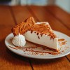 a piece of cheesecake on a white plate.jpg