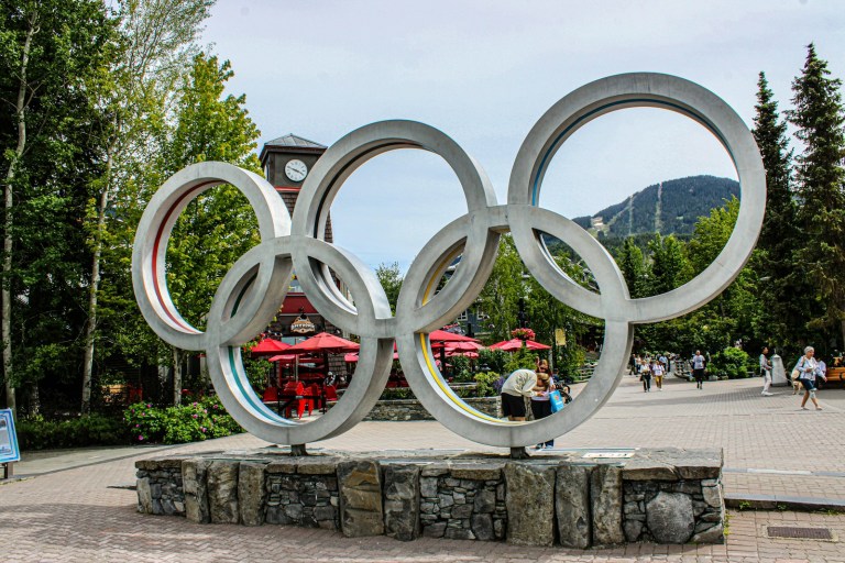 A statue of the olympic rings in a park.jpg