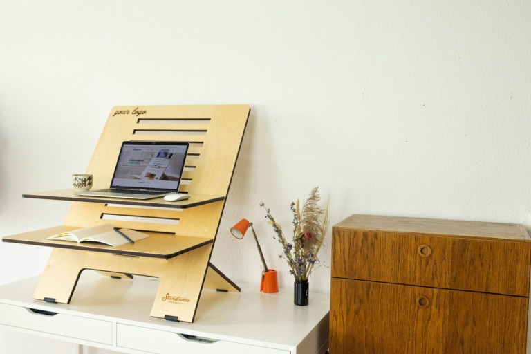 a desk with a computer on top of it.jpg