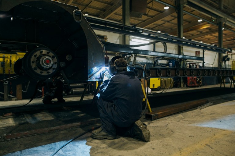 a man working on a machine in a factory.jpg