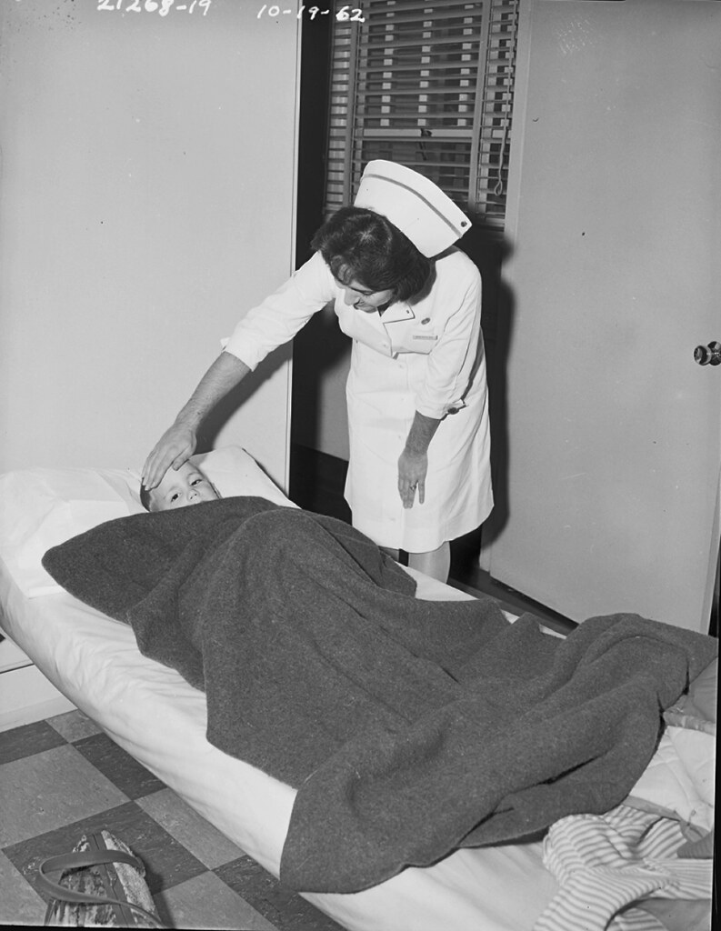 Nurse with sick boy, 1962.jpg