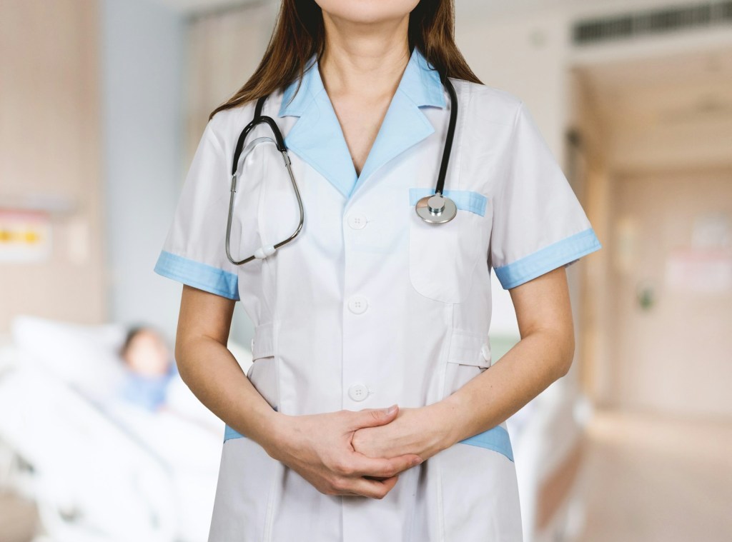 woman in white button up shirt and blue stethoscope.jpg