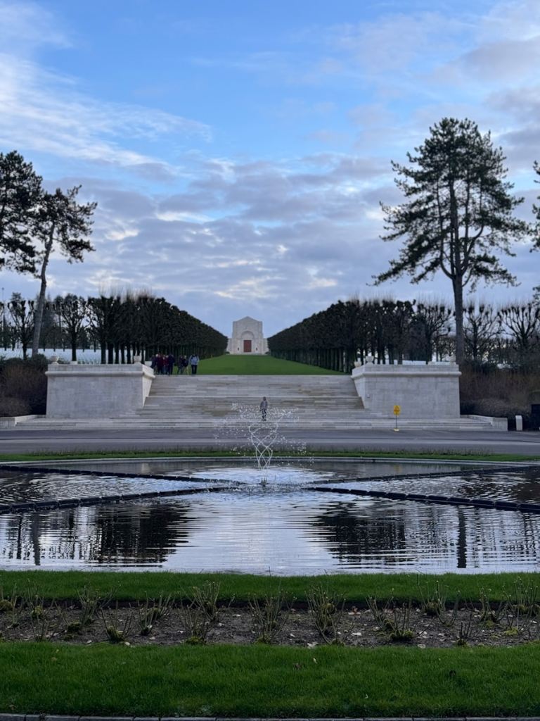 A view of a park with a fountain in the middle.jpg