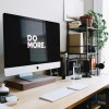 silver iMac with keyboard and trackpad inside room.jpg