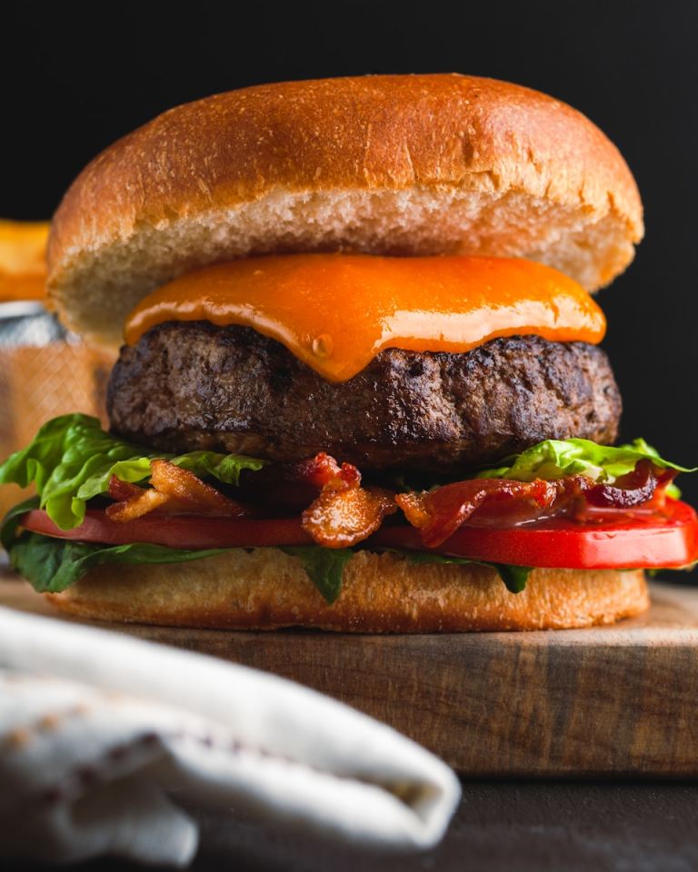 a cheeseburger with bacon, lettuce and tomato.jpg