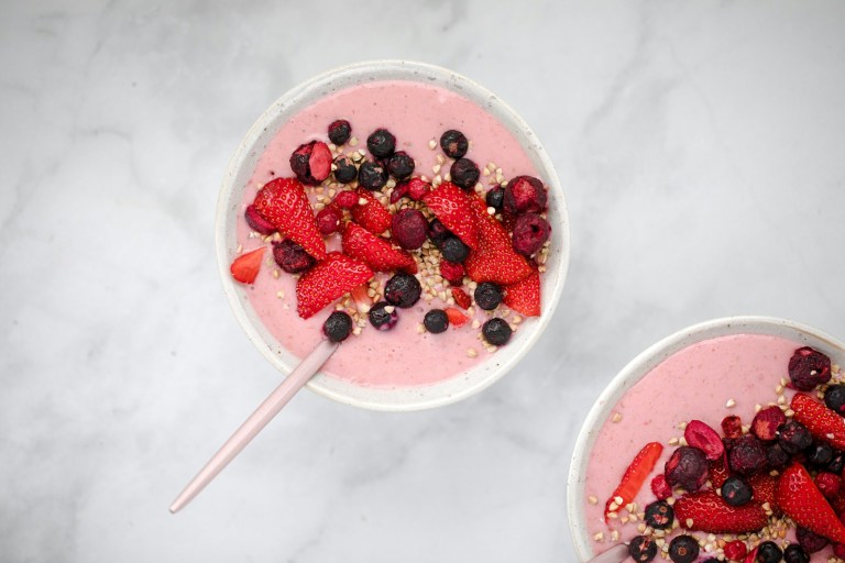 red and black berries in white ceramic bowl.jpg