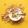 top view of corn flakes in bowl with milk and silver spoon.jpg
