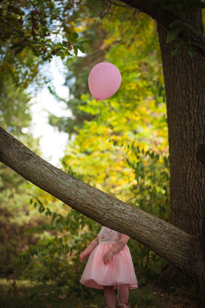 pink balloon on brown tree branch.jpg