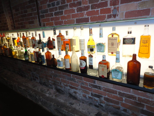 A large collection of Gooderham & Worts paper label whisky bottles.jpg