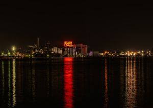 A large body of water with a city in the background.jpg