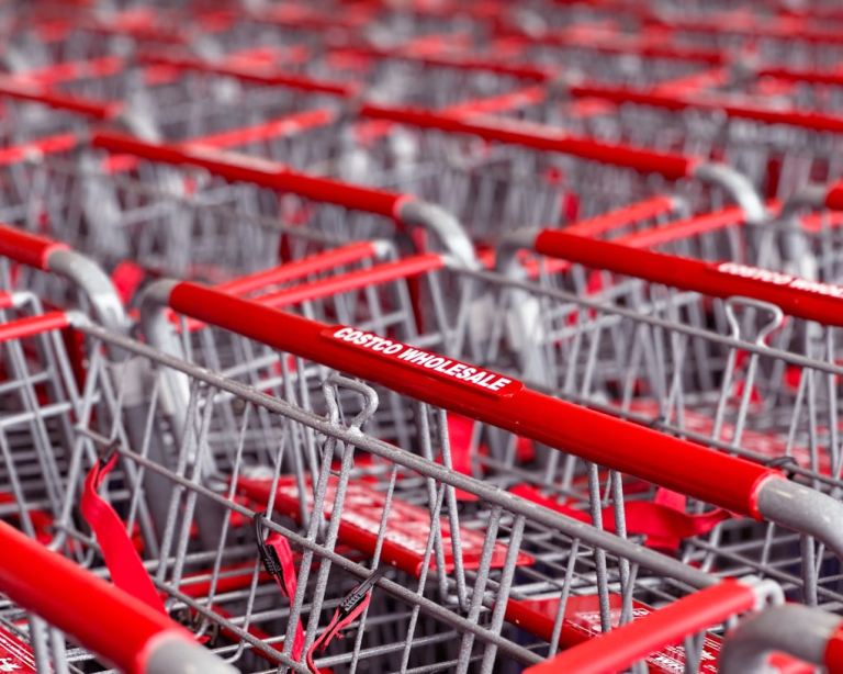 a row of red and silver shopping carts.jpg