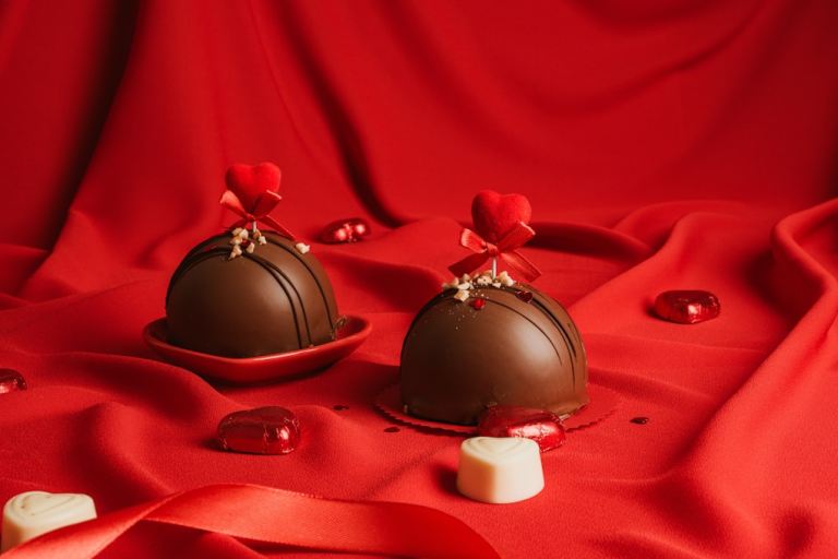 two pieces of chocolate sitting on top of a red cloth.jpg