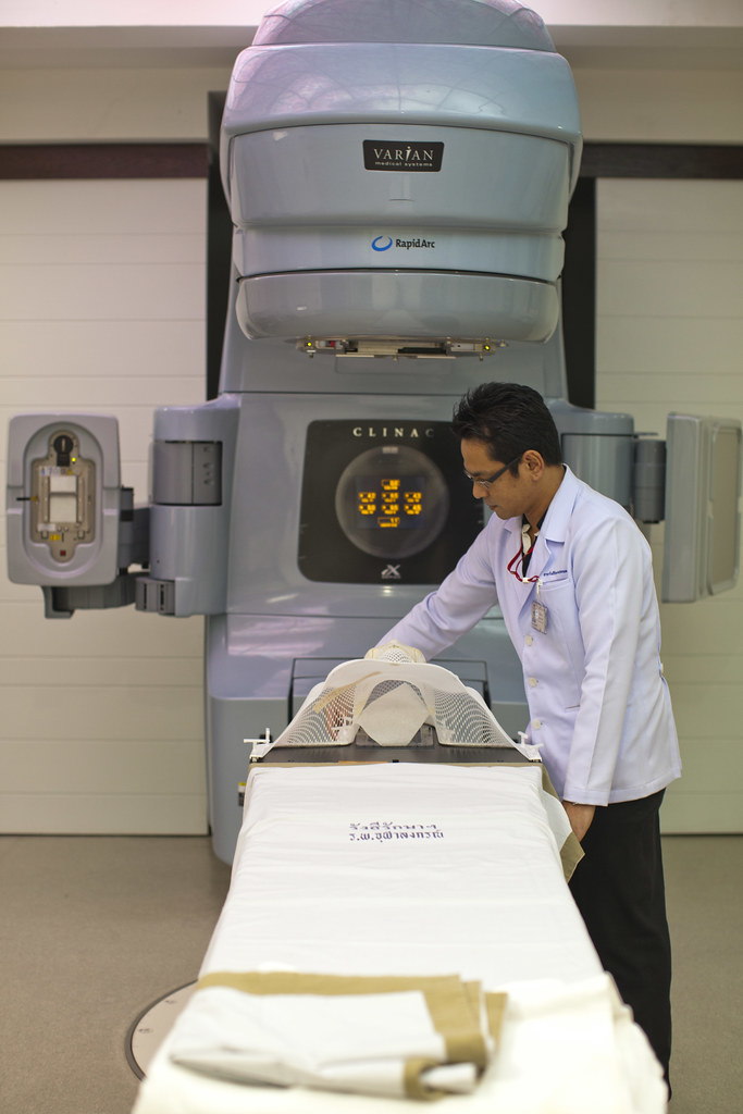 Technician prepares a high-tech medical imaging system.jpg